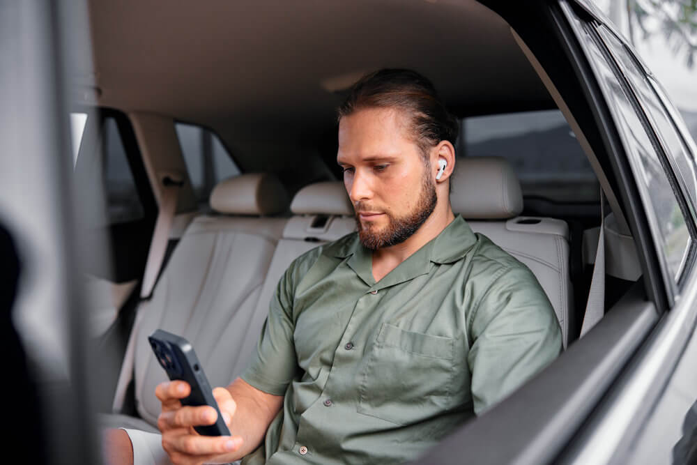 Man in car, on phone